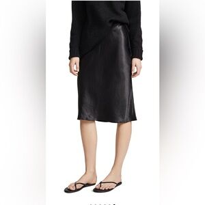 Vince black 100% silk midi skirt. Brand new, never worn with tags.